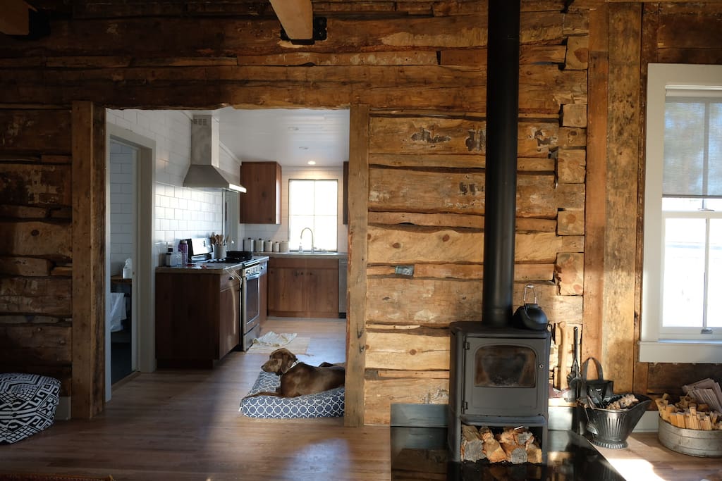 The Main Room of the cabin includes a Morsö wood burning stove as a supplemental heat source, and there is additional firewood located on the property.