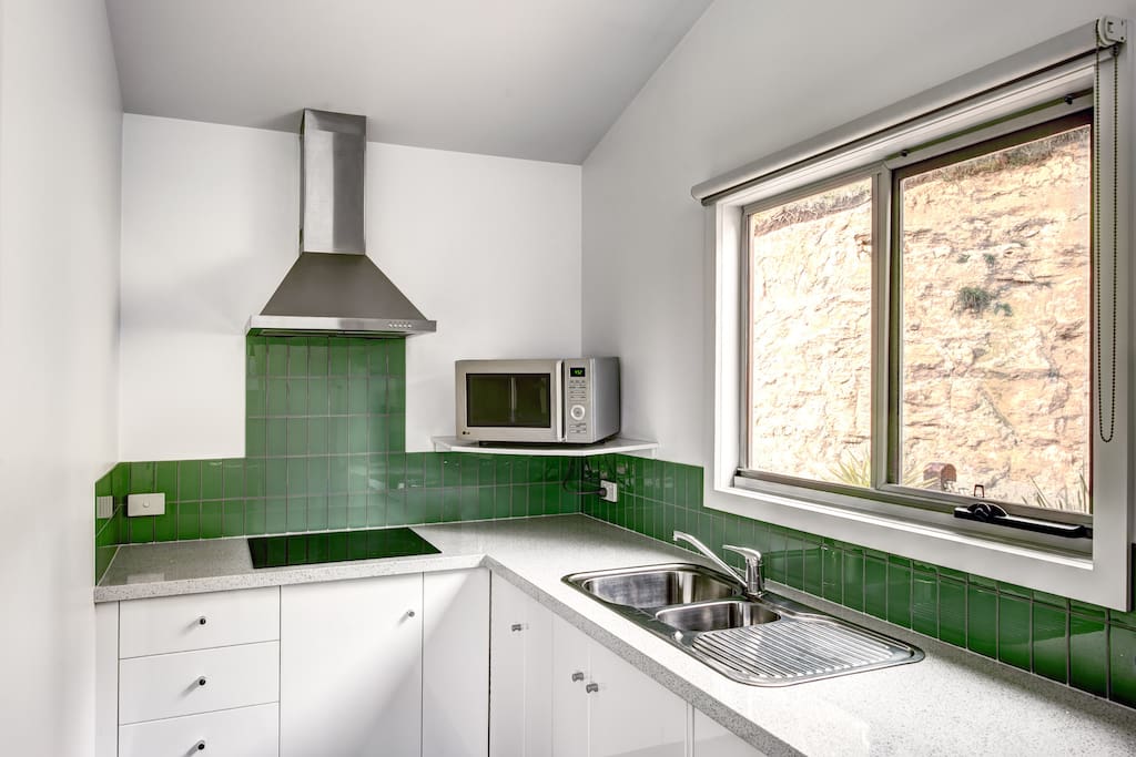 Stone bench, induction cooktop modern appliances