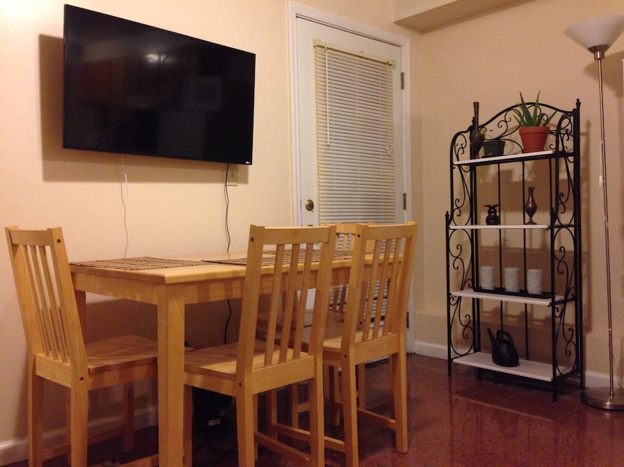 Dining table for 4; Smart TV with Netflix/You Tube etc. and 50+ digital channels; back door opens to the back yard