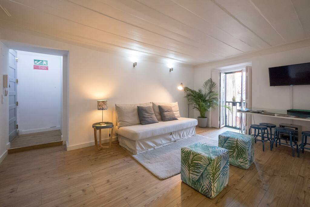 Living room with little balcony and sofa bed