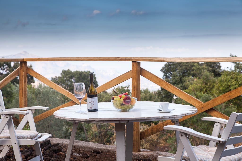 Enjoy wine while looking over the bay of Taormina