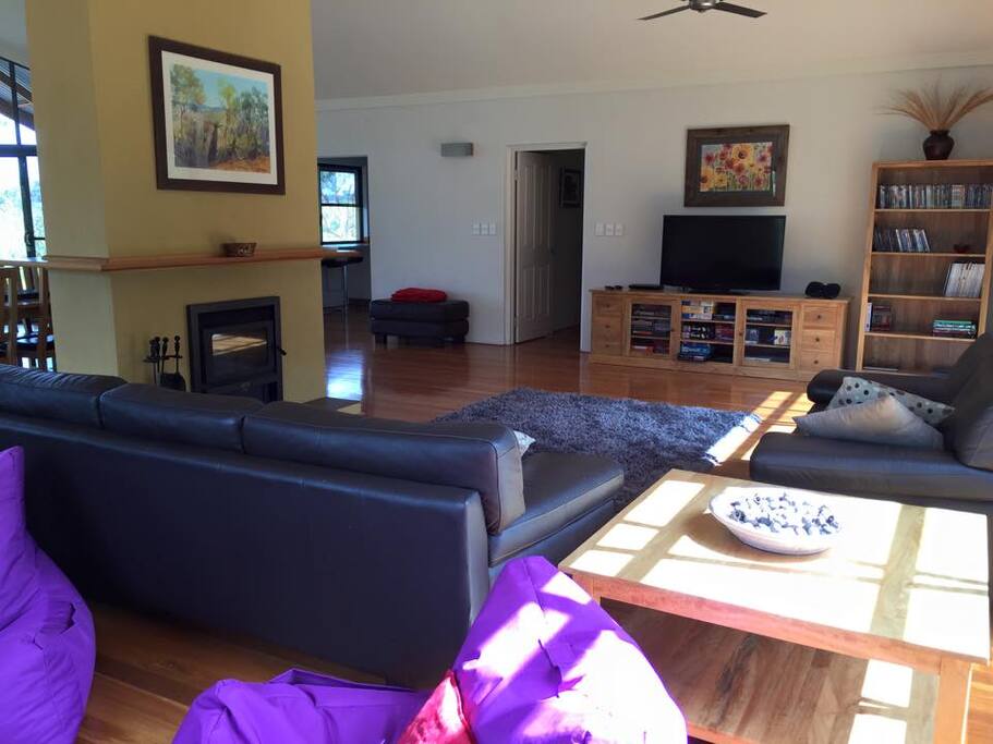 Watch a movie by the double-sided fireplace