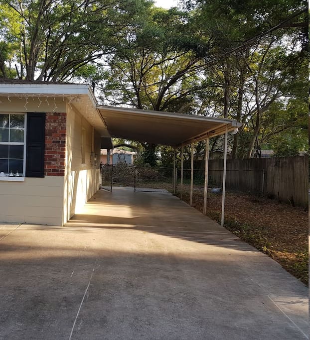 Private entrance at the back of the carport