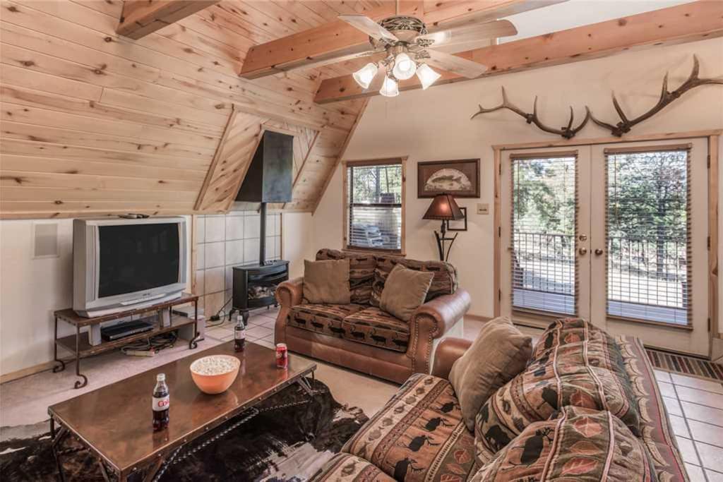 Spacious Living Room - Large comfortable couches, cable HDTV, and ceiling fan so you can enjoy your evenings with family and lots