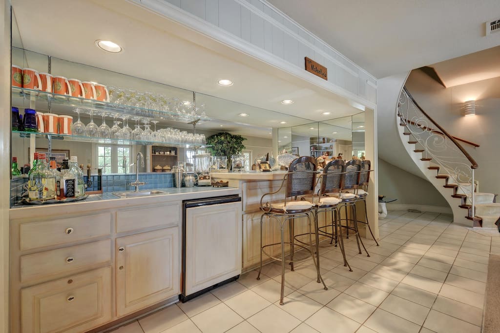 Classy, mirrored bar in the living area (and seating for 4).