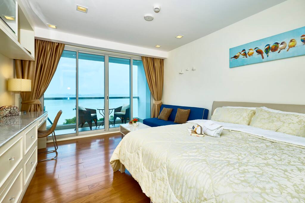 Studio room with new furnishings, glass balcony rail for unobstructed view, and Black-out UV Curtains block the sun completely when you want to sleep in late.