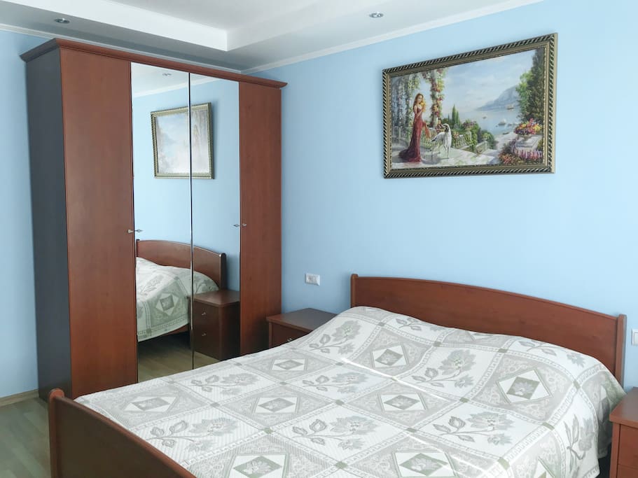 Bedroom with double bed and wardrobe set