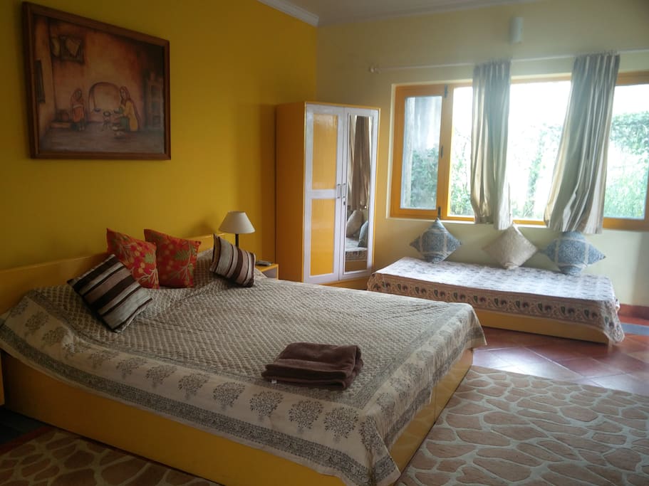 Cottage interiors. Bed with adjacent lounge / seating area