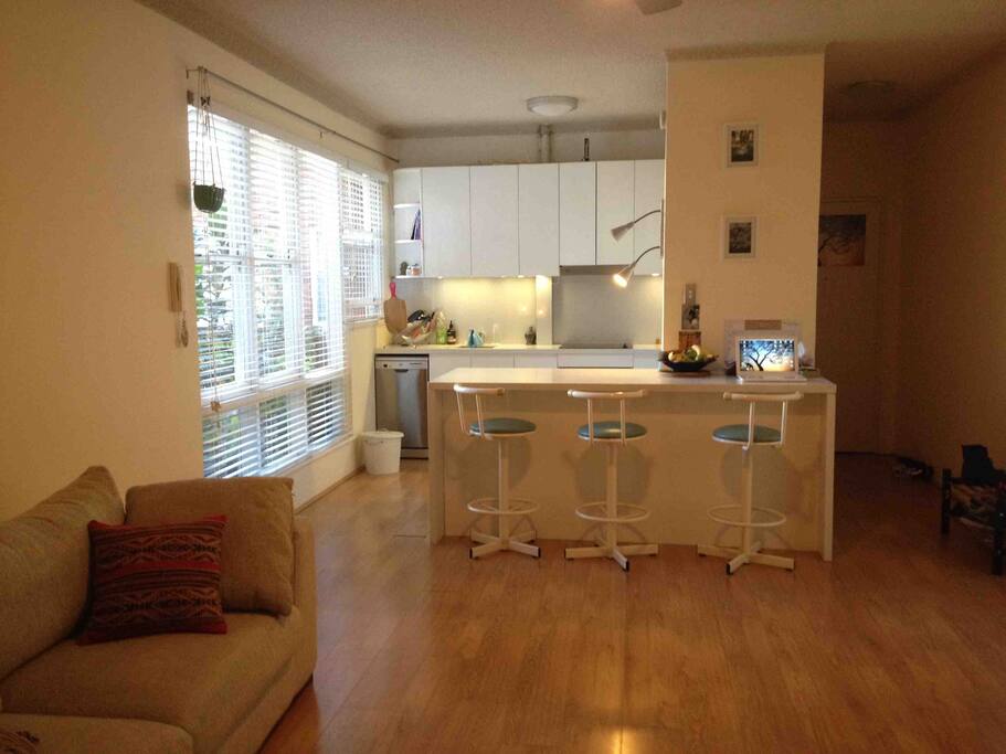 Modern Kitchen with breakfast bar looking out to garden