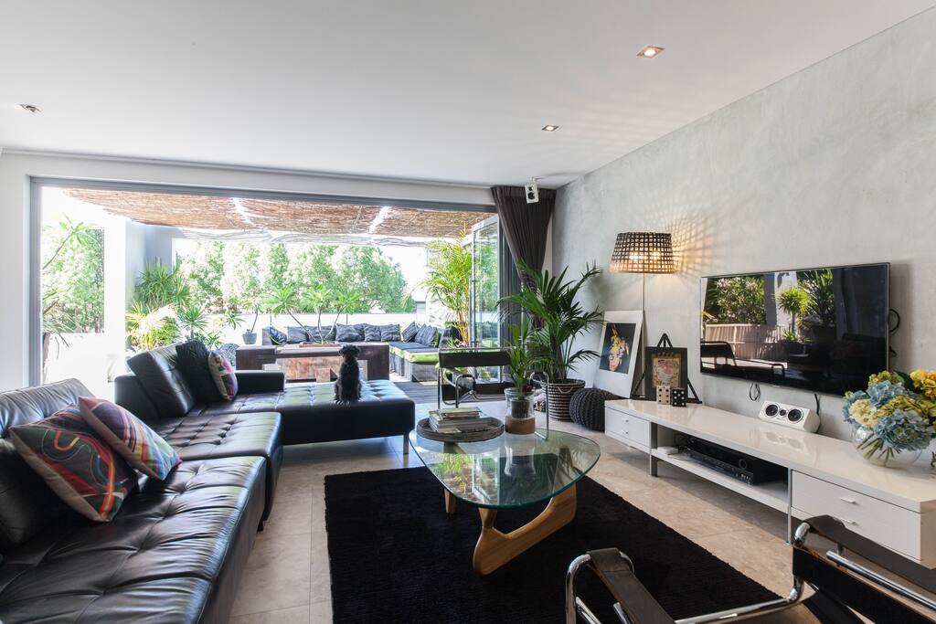 Living room overlooking lush green gardens