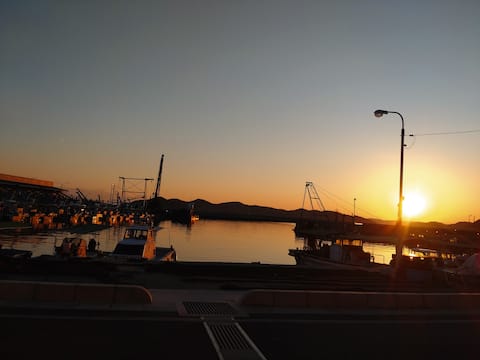 Traditional house on a hill overlooking the harbor | One group per day, peaceful island life