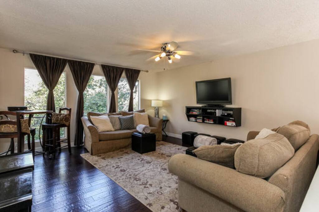 Comfortably living space with 2 oversided sofa's pub table, and breakfast bar