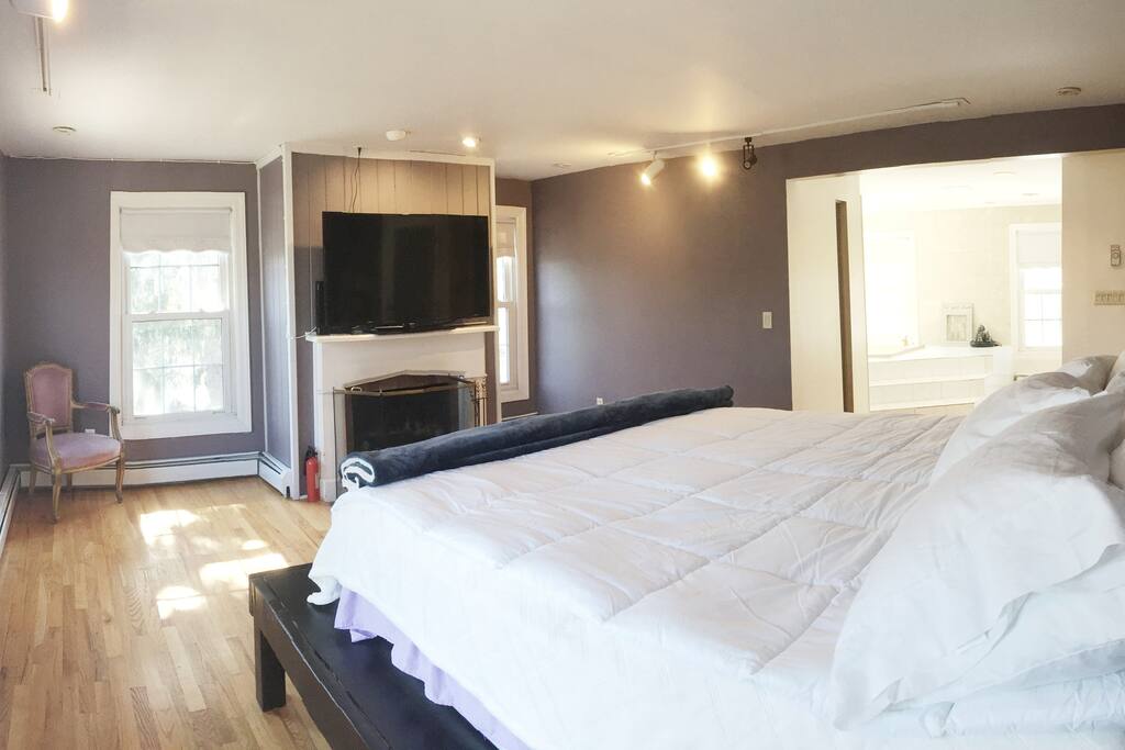 Your Bedroom Suite: Master bedroom with king size bed, private bathroom, working fireplace, 60" Flat Screen.