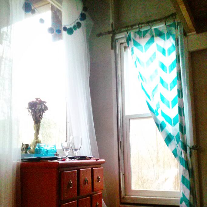 Plenty of natural light and a beautiful view of the forest accompany you