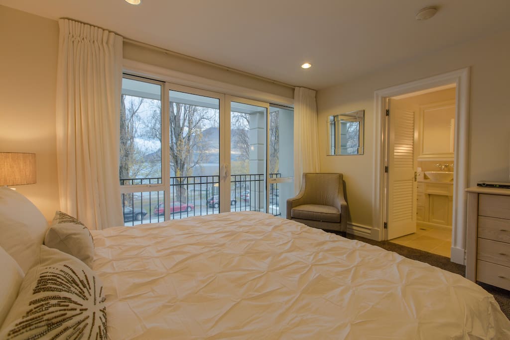 The master bedroom has a TV and private ensuite