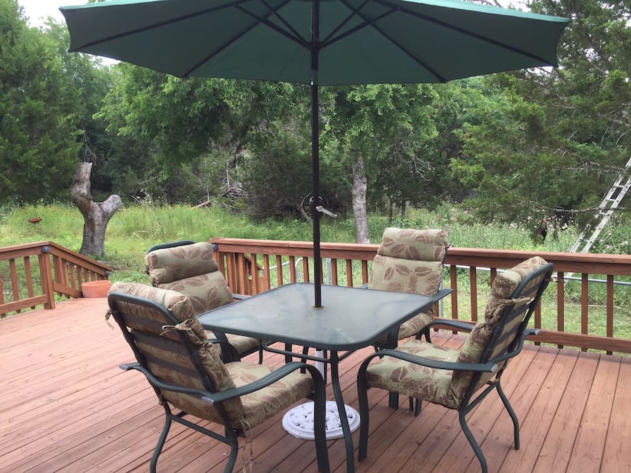 Relax with a morning cup of coffee or afternoon cold drink on the large deck and watch birds and deer
