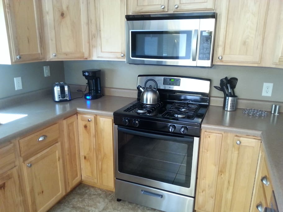 Brand new stainless appliances include gas range.