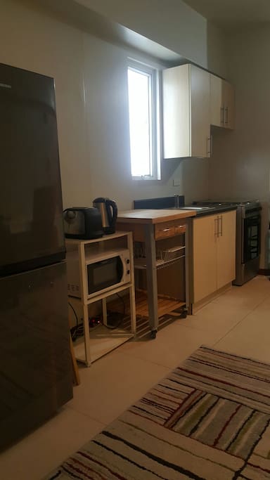 Kitchen with complete gas range, oven? Microwave, water heater, etc.
