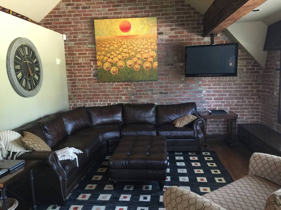 Living room with sectional and 36" screen tv