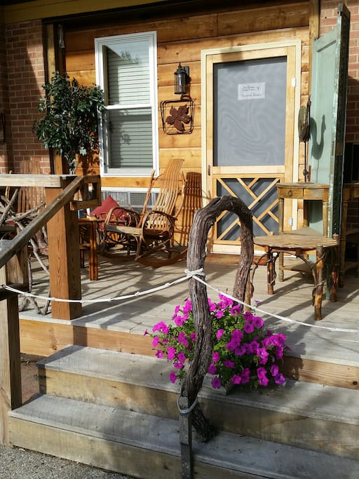 A wonderfully comfortable porch w/ bent wood rockers.