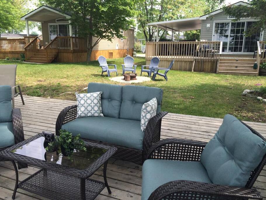 We have several areas for you to relax and unwind, including on this deck that overlooks the dock and water.