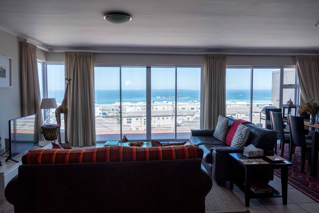 The lounge with large sliding doors onto the balcony