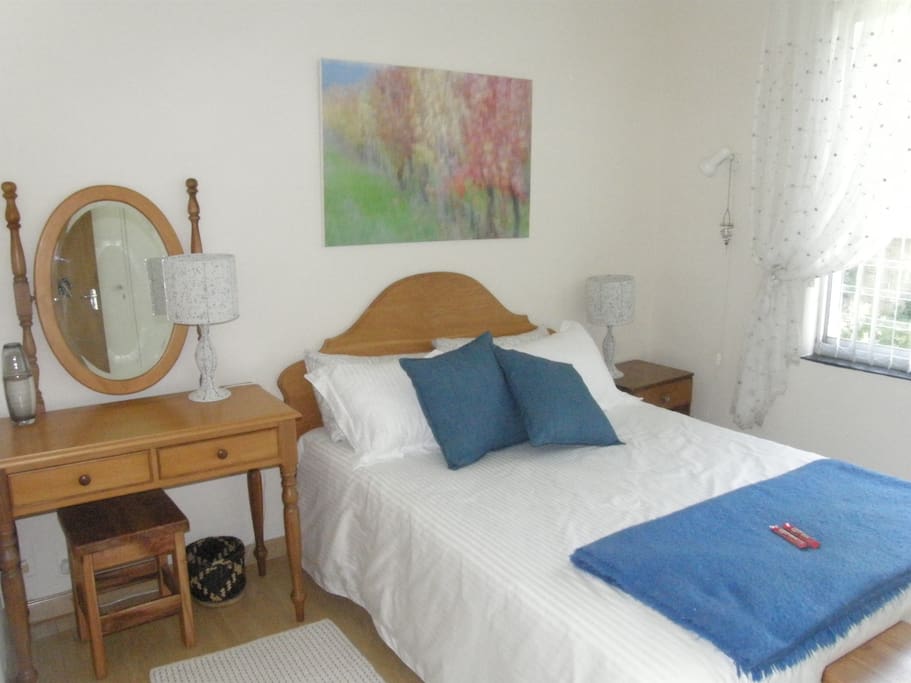 Double room with views of mountain and trees.