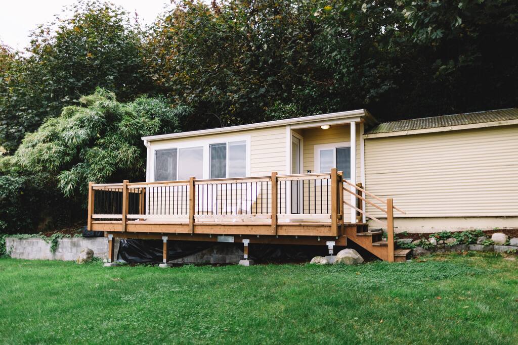 Cottage sits on big lawn.
