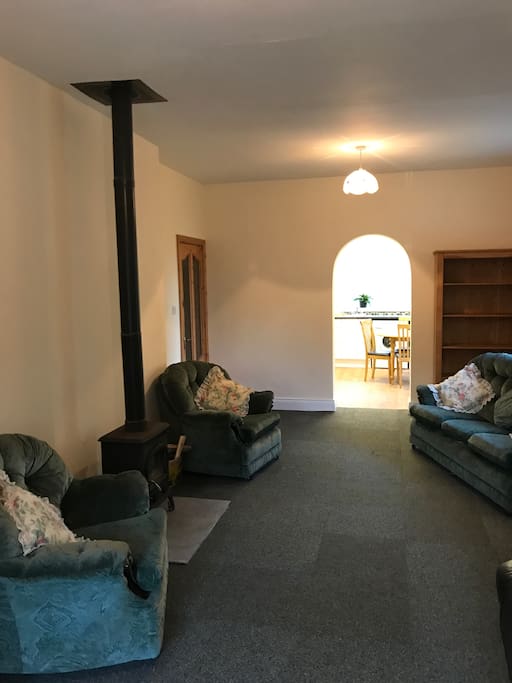 Living room, with stove. House also has central heating.