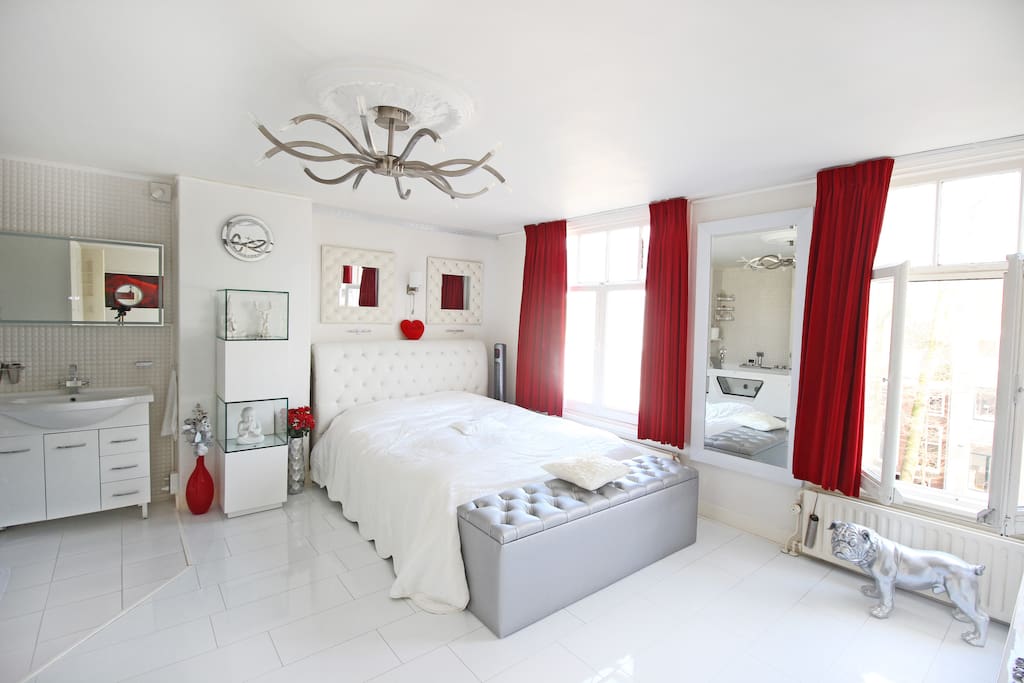 The master bedroom witch comfortable kind sized bed