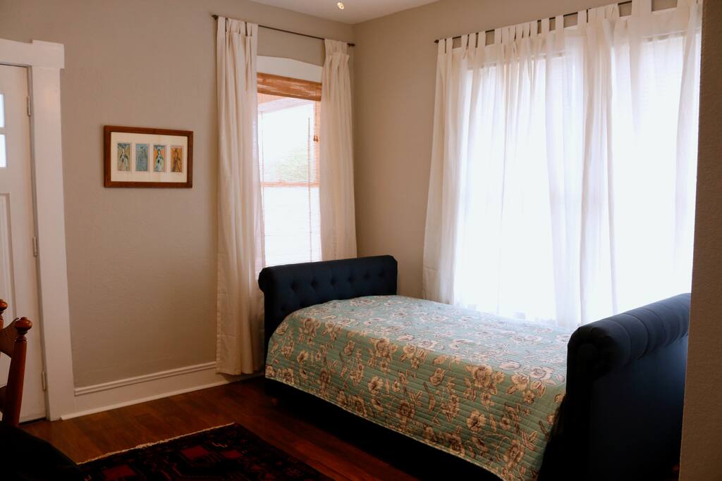 Workspace by day, sleep space by night, bedroom 2 has its own private entrance and sleeps 2 people with twin sized daybed + trundle.