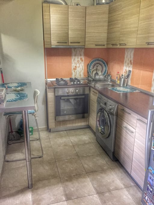 Kitchen-washingmachine, fridge,oven for cooking.