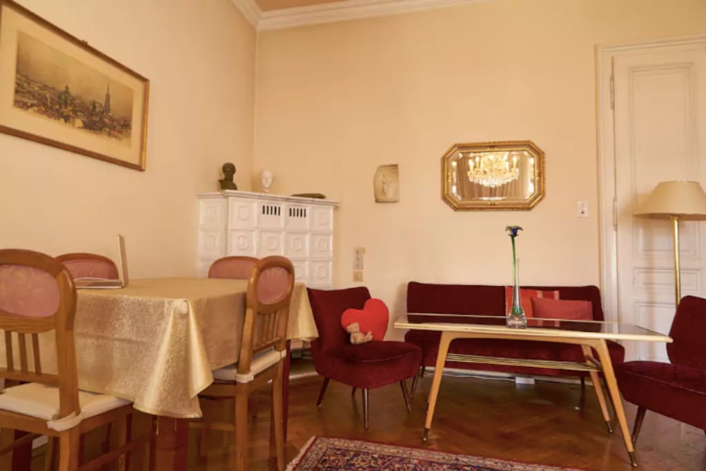 The living room from a different angle, with clasic viennese furniture and dining table.