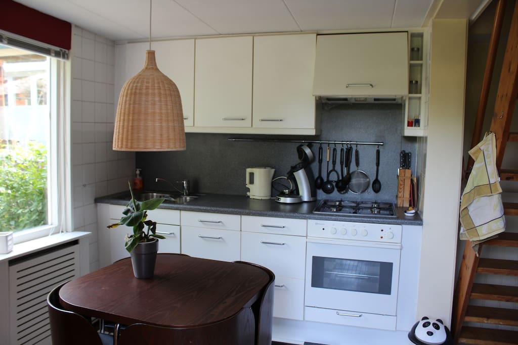 Kitchen with equipment and dining table