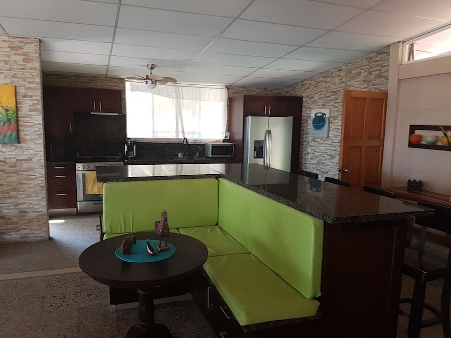 large island with seating for 8 with stools