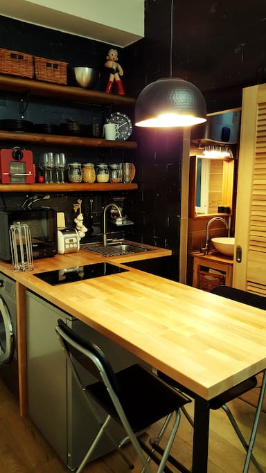 Delicately decorated kitchen with wood and black design concept.