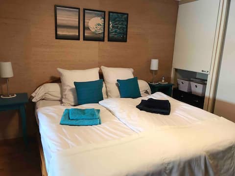 Large studio with a pool