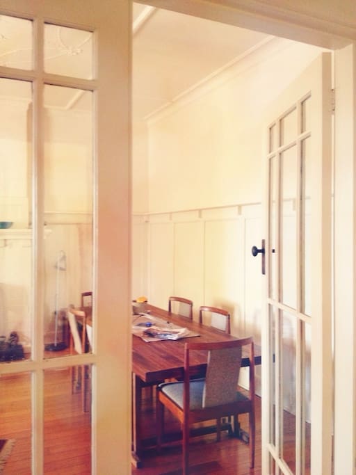 A glimpse of the dining table from the hallway. Gather friends, or just spend a lazy day reading over a cuppa. It's perfect.