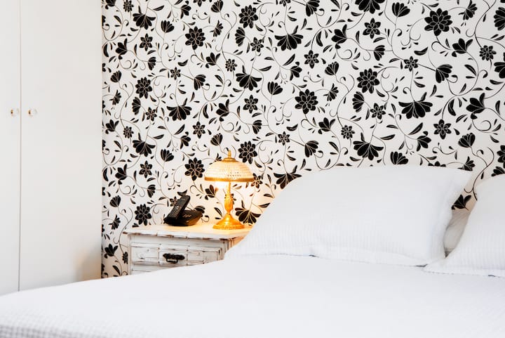 Master Bedroom with bathroom ( The bathroom has a shower included). (This can have 2 single beds or a double bed, at the guests' choice)