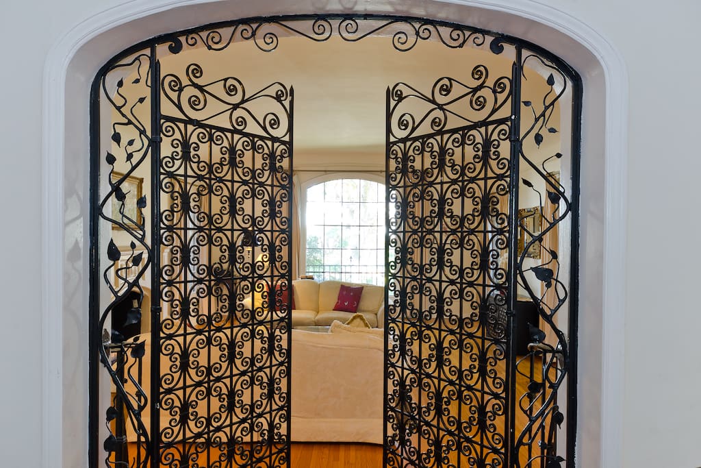 Incredible Period Hand Made Wrought Iron Gates leading from living from into the family room