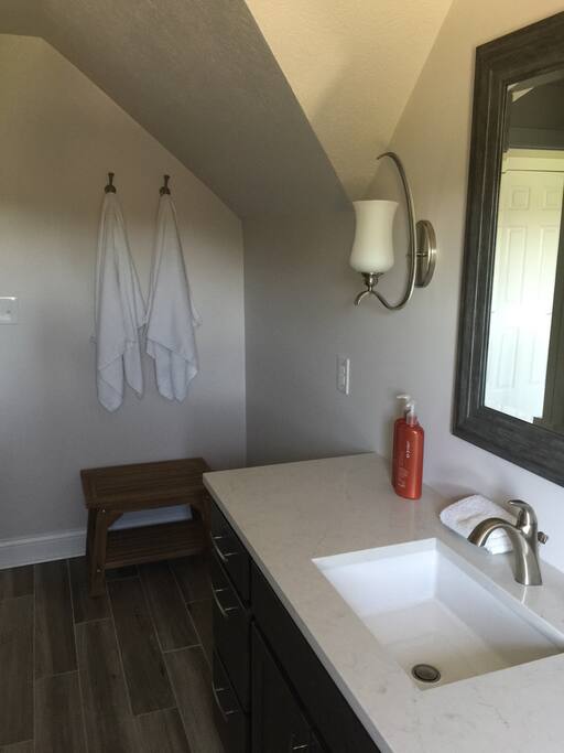 New bath with towels and plenty of storage. Also, basic toiletries and blowdryer.