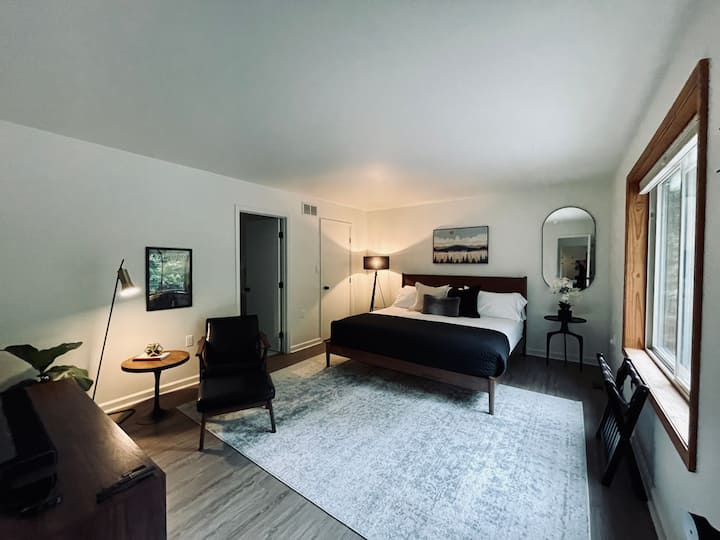 Main suite with ample room for the King-sized bed and seating area 