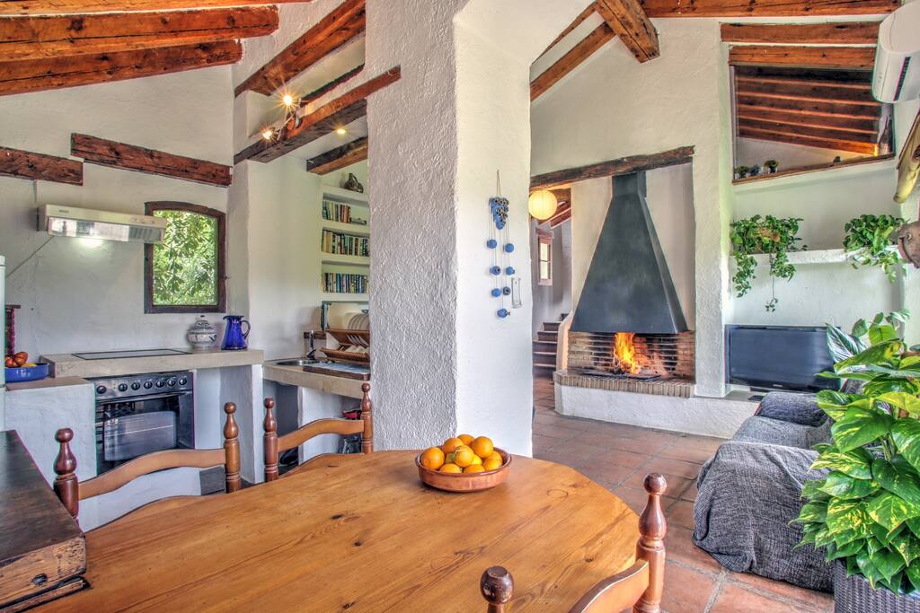 Dining table and sitting room with chimney