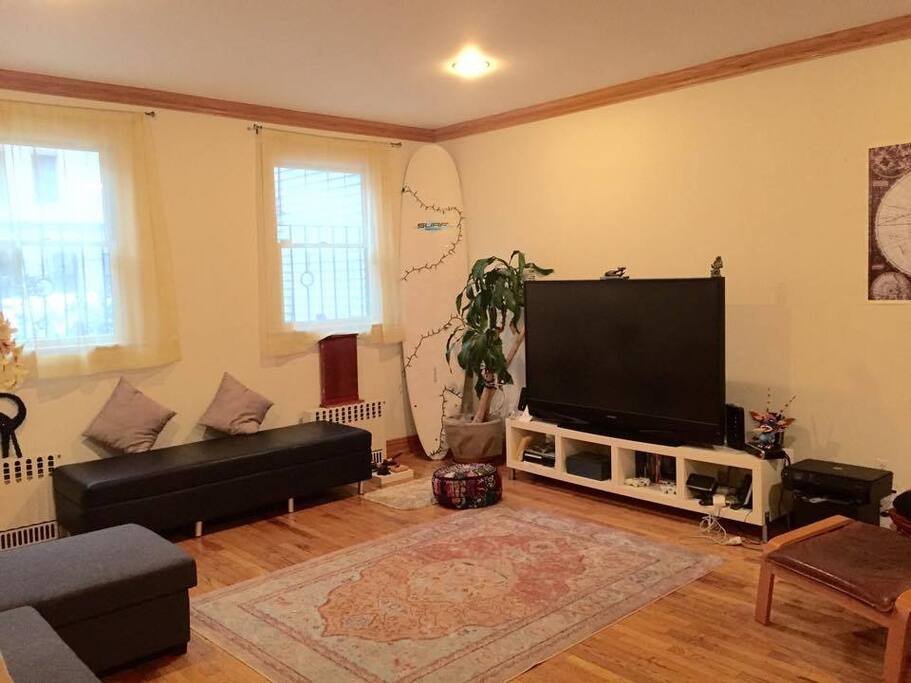 Bright Living Room with Extra Large TV