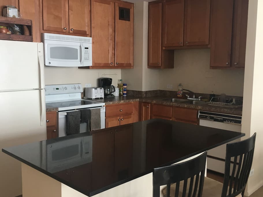 Large kitchen with huge granite island