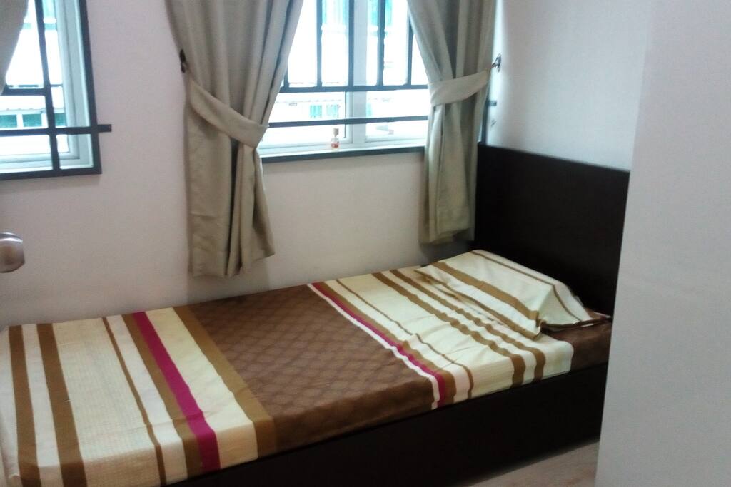 Second bedroom with Single Bed and wall fan