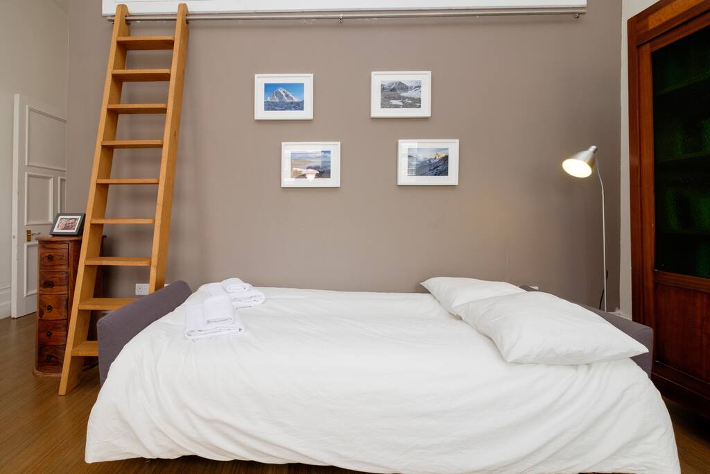 The sofa in the living room converts into a sofa bed suitable for 1 adult or 2 children