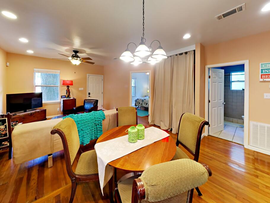 Open kitchen and adjacent dining table.