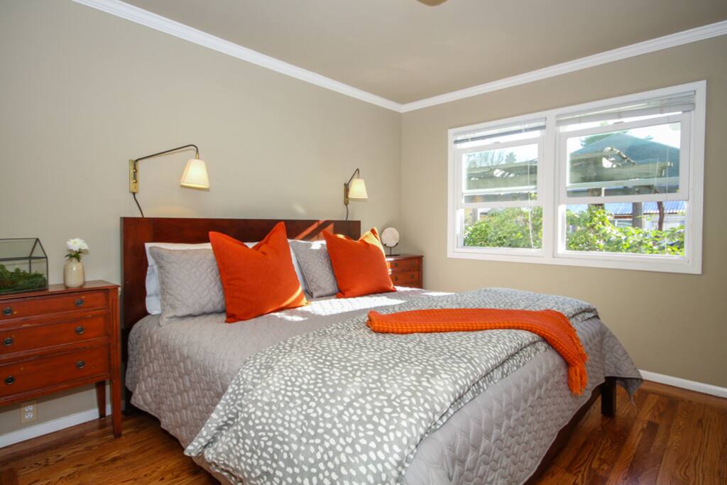 Comfortable king bed with cozy bedding.