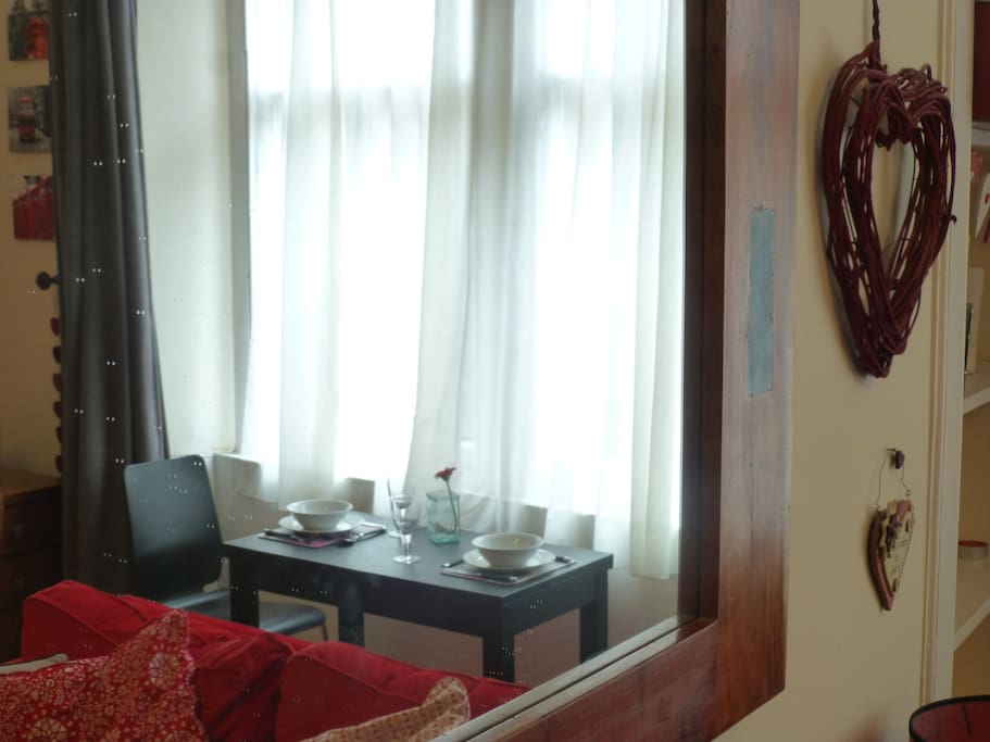 There is a dining table in the window